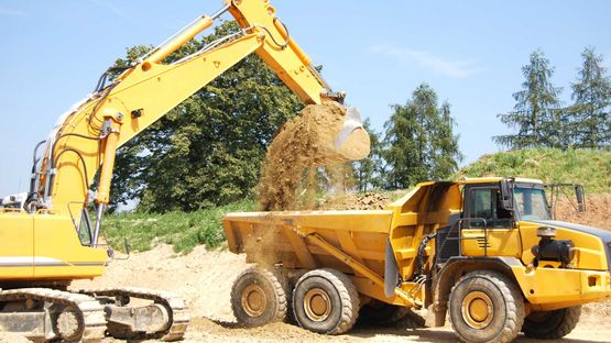 A excavator and dump truck 